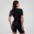 Macaquinho triathlon feminino preto, com detalhes em tecido, visto de costas.