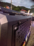 Capota Torden Adventure instalada em uma Nissan Frontier 2024, vista lateral com detalhes do acabamento e suporte.
