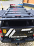 Vista superior da capota Torden Adventure instalada em uma Nissan Frontier 2024, com luzes de emergência e logotipo da Polícia Civil.