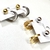 Argola Pequena com Ponteira Oval - Dourado e Prata - comprar online