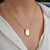 Colar Medalha Oval Maya 60cm Banho Ouro 18k na internet