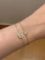 Pulseira botão cravejado na internet