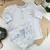Conjunto Bata ou Body Branca e Bermuda Coelho Colors Azul Índigo Trend