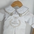 Conjunto Bata ou Body Gola Branca Cambraia Bordado Letra Inicial e Jardineira Macacão Charles Branca e Toalha Branca Batizado João Batista Bordado Índigo Trend - comprar online