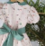 Imagem do Kit Irmãos Vestido Princesa Com Manga Bufante Natal Bosque dos Sonhos Verde Oliva e Laço Natal e Camisa Social ou Body Verde Oliva Bangalore Detalhes Natal Bermuda Esporte Fino Gravata Borboleta e Suspensório Natal Índigo Trend