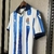 Camisa Real Sociedad Casa 23/24 - Versão Torcedor Masculino - Macron - Branco e Azul - loja online