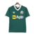 Camisa retrô verde do Palmeiras, modelo de 1987, com detalhes em branco e logos da Adidas e Agip.