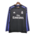 Camisa third longa preta do Real Madrid da temporada 16/17, versão retrô, com detalhes em roxo e logo da Adidas.