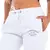 Pantalones de jogging blancos de la marca DC, con detalles de la compañía en la parte frontal.