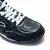 Botines Joma Top Flex TF para hombre, en color negro, con detalle de cordones blancos y logotipo visible.