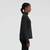 Buzo New Balance Sport Ess Space Dye Quarter Zip para mujer, visto de perfil, color negro.
