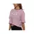 Remera crop de mujer Under Armour en color rosa, con logo en el frente.