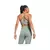 Top deportivo strappy de mujer de Reebok en color claro, visto desde atrás, con detalles de diseño en la espalda.