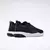 Zapatillas Reebok Flexagon Force 4 para mujer en color negro, vistas desde atrás, con suela blanca.