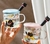 Taza De Vidrio Con Tapa de Ceramica Celeste y Cucharita Gato Negro 350 Ml - comprar online