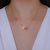 Colar Letra de Microzirconias com Zirconia Quadrada no Dourado com Rosa Claro na internet