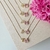 Colar Letra de Microzirconias com Zirconia Quadrada no Dourado com Rosa Claro