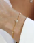 Pulseira com Flor Gotas em Zircônia e Ponto de Luz no Dourado - comprar online