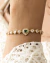 Pulseira Ajustavel Corações de Zirconias e Cristal Verde Esmeralda no Dourado - comprar online