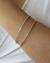 Pulseira Bracelete Duplo Fino de Microzirconias no Aço e Dourado - comprar online