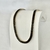 Colar Choker Riviera Baguetes de Cristais Negros no Dourado - comprar online
