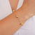 Pulseira com Bolas Lisas na Corrente Cartier no Dourado - comprar online
