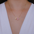 Imagem do Colar Letra de Microzirconias com Zirconia Quadrada no Dourado com Rosa Claro