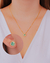 Conjunto Cristal Verde com Microzirconias em Volta no Dourado