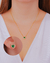Conjunto Brinco e Colar Coração de Cristal Verde com Microzirconias em Volta Dourado