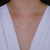 Colar Letra de Microzirconias com Zirconia Quadrada no Dourado com Rosa Claro - comprar online
