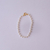 Pulseira Infantil de Pérolas no Dourado na internet