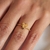 Anel Aro Torcido Coração com Estrela e uma Microzirconia no Dourado - comprar online
