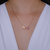 Colar Letra de Microzirconias com Zirconia Quadrada no Dourado com Rosa Claro na internet