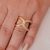 Anel X Entrelaçado Lado Liso e Lado com Microzirconias Roxas no Dourado