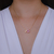 Colar Letra de Microzirconias com Zirconia Quadrada no Dourado com Rosa Claro na internet