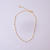 Colar Choker Pérolas e Bolinhas no Dourado na internet