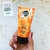 Crema facial matificante de Organic Shop para piel grasa, con extracto de calabaza y miel, presentada en tubo naranja.