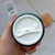 Frasco de crema facial Well Ageing Reafirmante Hidratante de BEK, visto desde arriba, con tapa blanca y etiqueta visible.