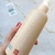 Botella de leche corporal hidratante Well Aging de Jojoba, mostrando la parte posterior con información del producto.
