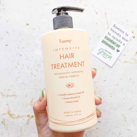 Envase del tratamiento capilar intensivo Coony para cabello dañado y seco, con ingredientes como aceite de semilla de Camellia Japonica y aceite de almendras dulces.