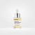 Frasco de serum renovador de pies de Dekka, con gotero y etiqueta que indica ingredientes como 10% de glicólico y 10% de urea.