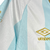 Camisa Atlético Tucumán Home 24/25 - Torcedor Umbro Masculina - Azul claro e branco com detalhes dourados - DNL Sportline | Camisas de Futebol