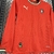 Kit Infantil Portugal Home 25-26 Manga Longa - Puma - Vermelho com detalhes em verde - DNL Sportline | Camisas de Futebol