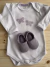 Body e pantufa borboleta na internet