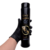 Frasco de lubrificante íntimo Garji Lubes Fist, 420ml, sendo segurado por uma mão com luva preta.