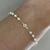 PULSEIRA MINI PÉROLAS E PONTO DE LUZ