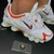 SHOX TL 12 MOLAS - BRANCO E LARANJA - comprar online