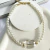 CHOKER DE PÉROLA COM PINGENTE TRANSPARENTE
