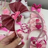 Tiara laço em pé Barbie rosa pink.