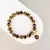 Pulseira Guardian - Pedra Natural Olho de Tigre e Banho de Ouro 18k - comprar online